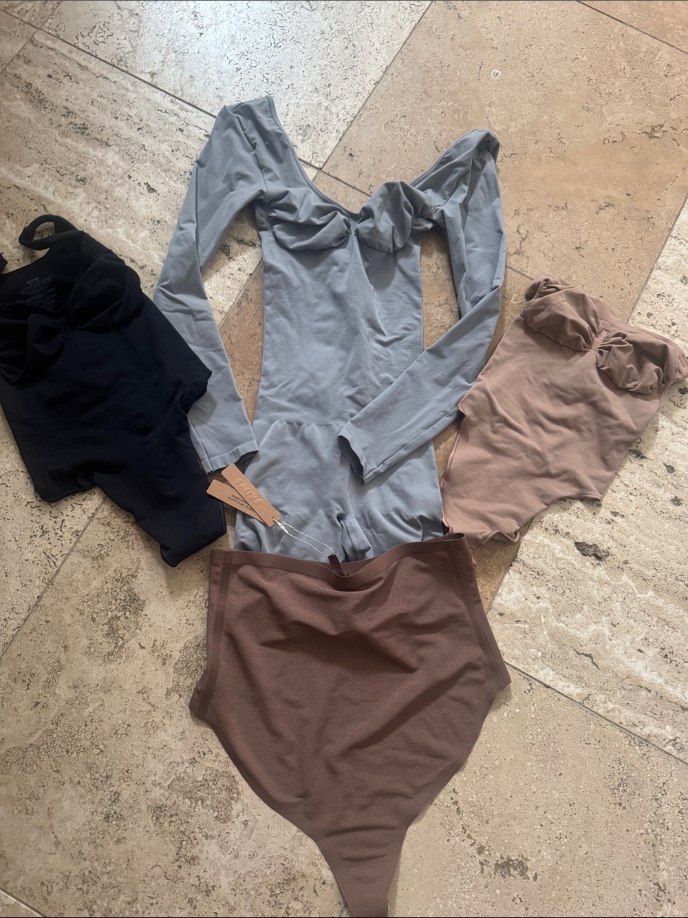 SKIMS Long-Sleeve Twist-Front Bodysuit Set in Light Gray, Black, Taupe and Brown